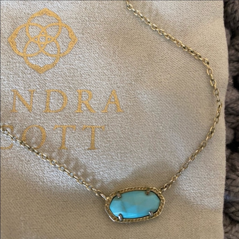 Kendra Scott gold pendant in Turqoise
